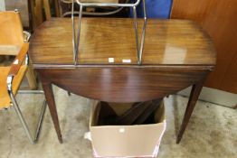 A mahogany drop flap table.