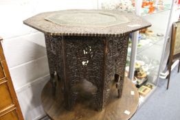 A good eastern hardwood and pierced brass tray table.