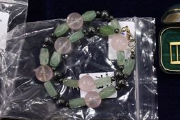 A decorative jadeite and quartz necklace.