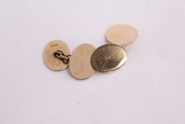 A pair of 15ct gold plain oval cufflinks.