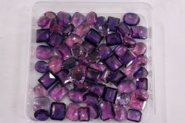 A box of loose coloured stones.