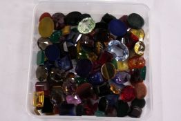 A box of loose coloured stones.