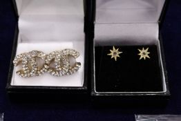 Two pairs of decorative earrings.