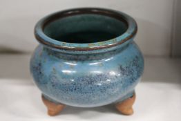 A Chinese tripod censer with turquoise glazed decoration.