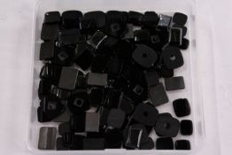 A box of loose coloured stones.