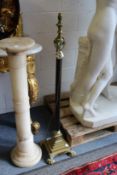A brass Corinthian column style floor standing telescopic lamp.