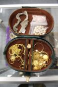 A jewellery box containing costume jewellery.