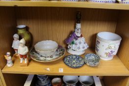 A shelf of decorative china.