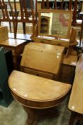 A demi-lune console table, a small oak bureau and a Victorian dressing chest.
