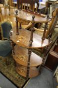 A Victorian inlaid walnut four tier what-not.
