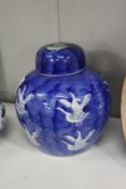 A Chinese blue and white ginger jar and cover, decorated with geese.