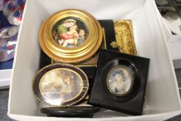 A group of miniatures, a small porcelain circular plaque, a gilt frame etc.