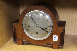 An oak mantle clock.
