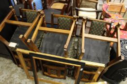 A set of six upholstered dining chairs.