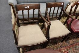 A pair of George III style mahogany armchairs.