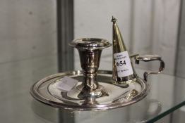 A plated chamber stick with snuffer.