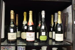 Twelve bottles of sparkling wine.