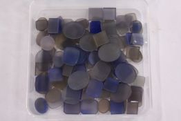 A box of loose coloured stones.