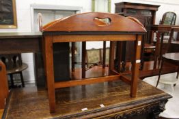 A reproduction mahogany butler's tray with stand.