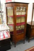 An Edwardian mahogany display cabinet.