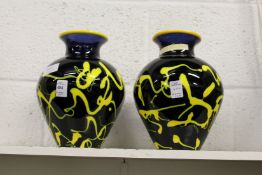 A pair of colourful studio glass vases.