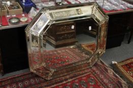 A Venetian style mirror.