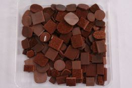 A box of loose coloured stones.