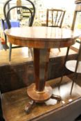 A Victorian rosewood circular occasional table.