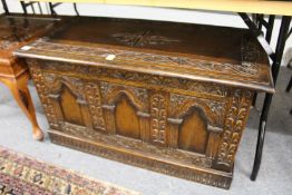 A carved oak coffer.