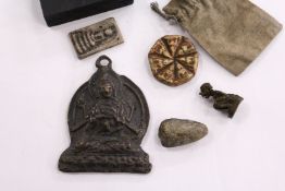 A Tibetan bronze pendant on stand and various other items.