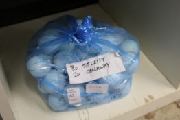 A bag of thirty Titleist and twenty Callaway golf balls.