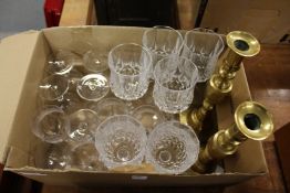 A pair of candlesticks and various glassware.