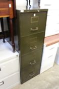 An old metal four drawer filing cabinet and modern two drawer filing cabinet.