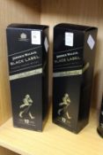 Two bottles of Johnnie Walker Black Label whisky, boxed.