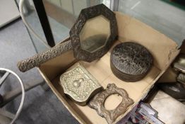 An ornate hand mirror, the frame decorated with figures, a Japanese cast metal circular box and