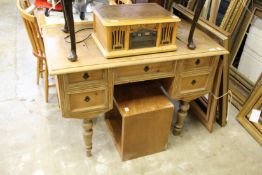 A continental pine kneehole desk.