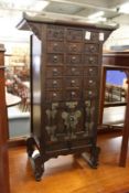 A Chinese multi-drawer table-top cabinet / chest.