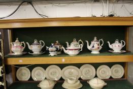 A collection of late Victorian lustre and other decorated teapots and sucriers.