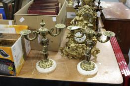 A pair of ornate figural lamp bases.