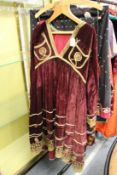 An Afghan plum velvet and hand embroidered riding dress.