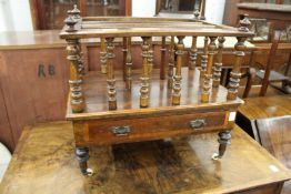 A Victorian walnut Canterbury.