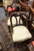A pair of Victorian mahogany dining chairs.