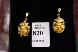 A pair of pine cone design gilt earrings.