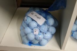 A bag of fifty mixed golf balls.