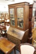 A good George III bureau bookcase, the upper section with pair of mirrored doors over a fall flap,