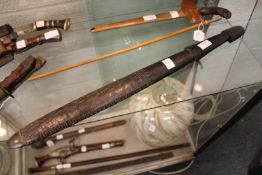 A Polynesian carved hardwood club.