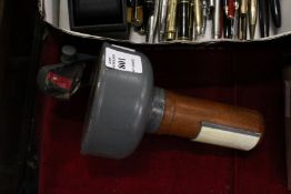 A hand held Naval compass.