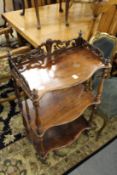 A Victorian rosewood three tier what-not.