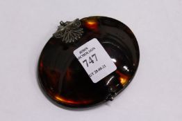 A tortoiseshell and white metal mounted hinged hand mirror.