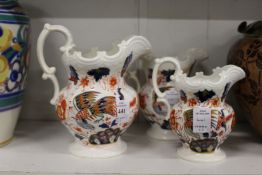 A graduated set of three Imari decorated jugs from the Murray collection.